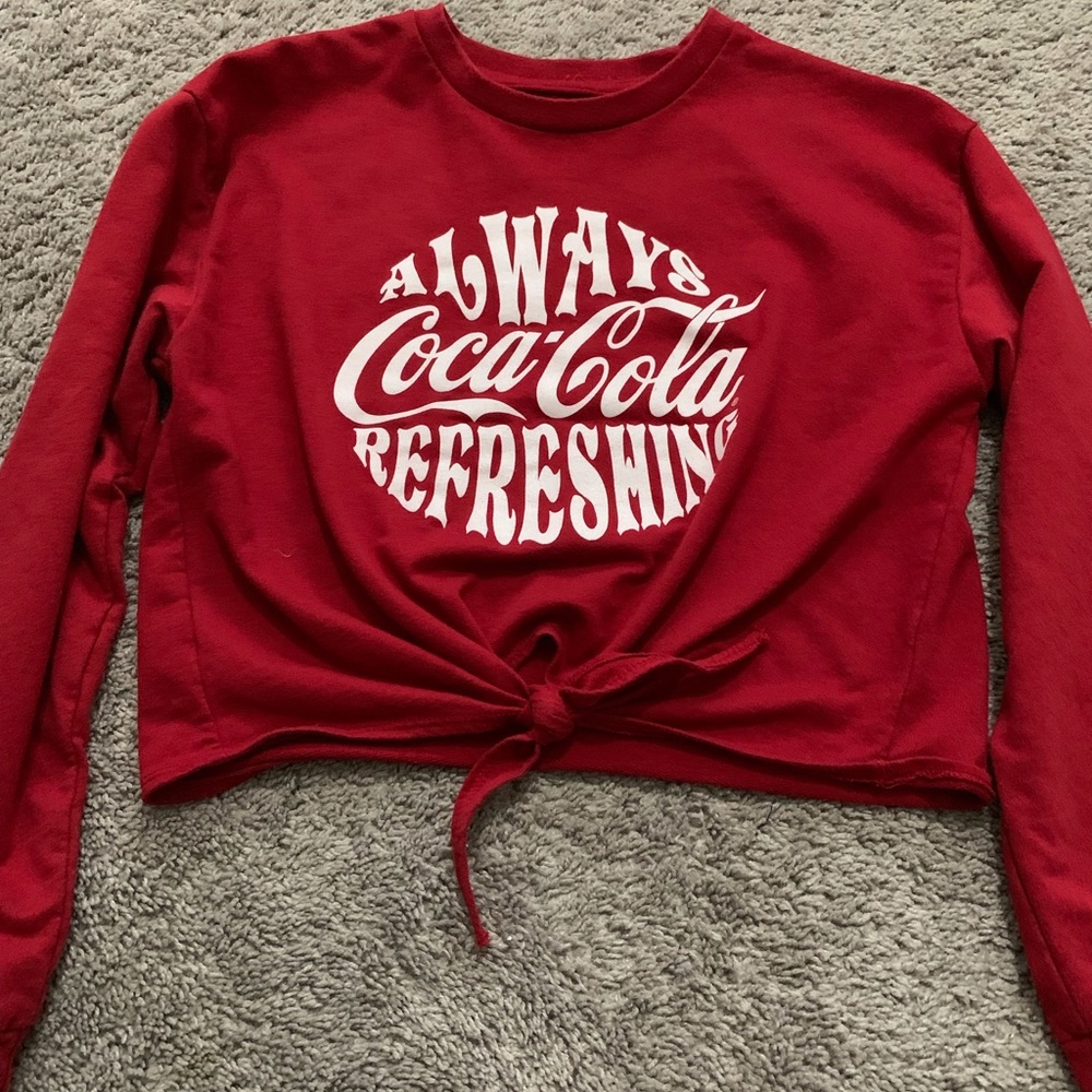 A long sleeve red Coca-Cola crop top